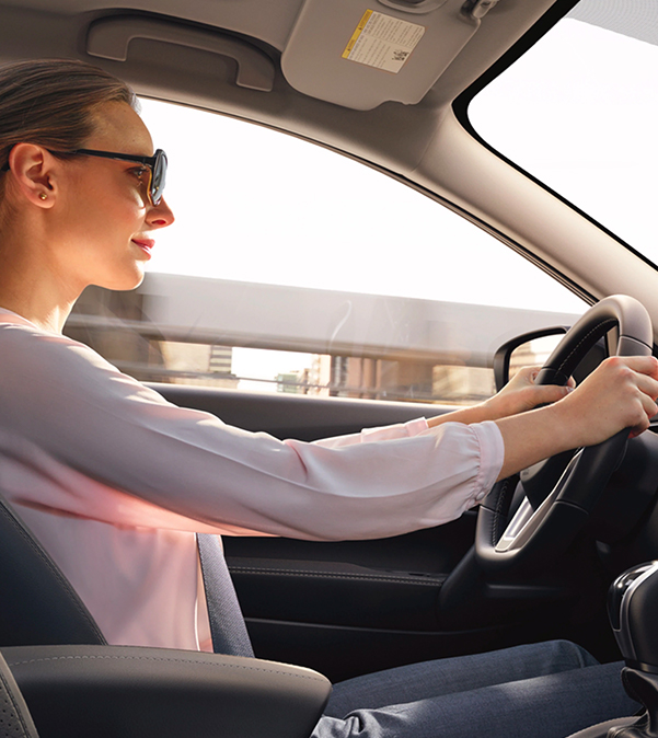 Woman Driving Nissan Car