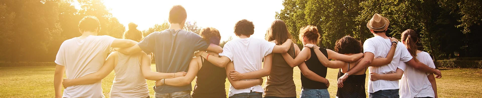 large group of friends together in a park having fun