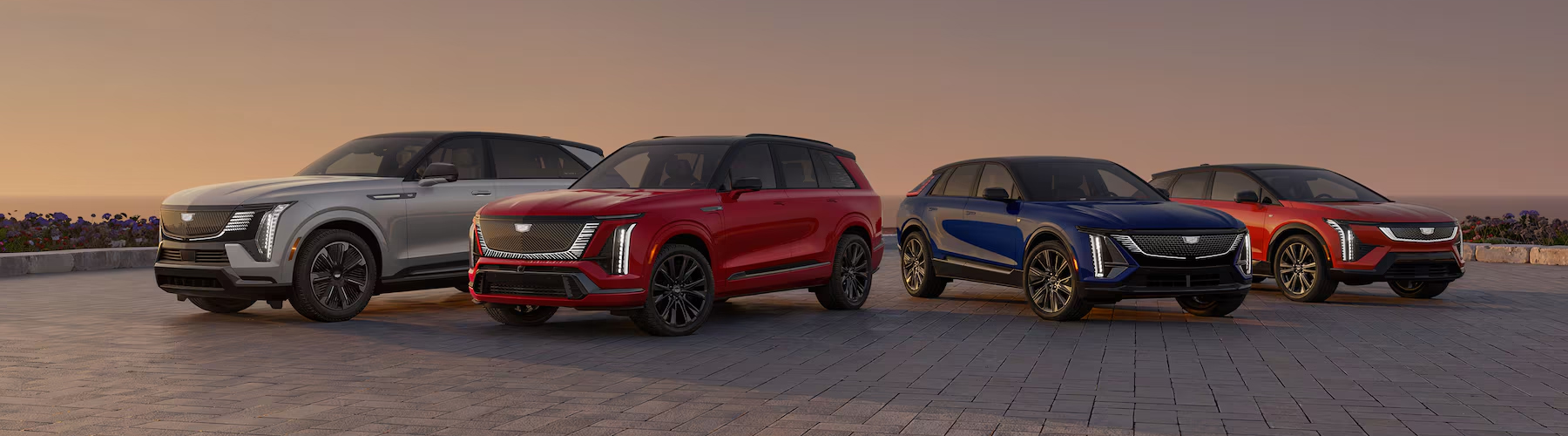 The Cadillac Electric Vehicle Line-up Parked Under a Beautiful Sunset