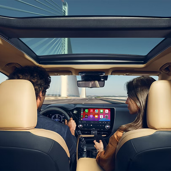 Happy couple inside a spacious Lexus