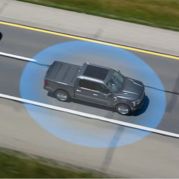 Ford driving on a street with graphic explaining BlueCruise.