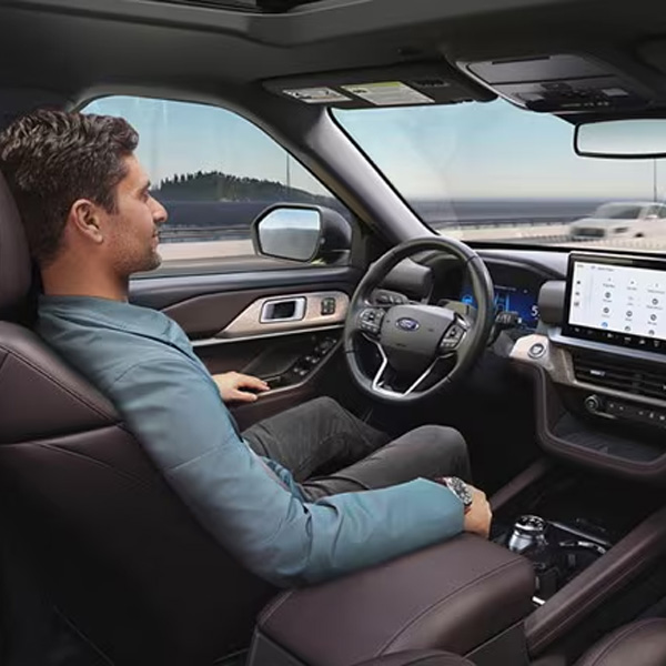 Person driving a ford.